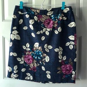 Blue skirt with pink/white/blue flowers, lined with back kick flap